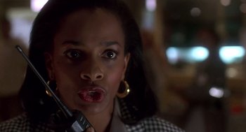 Movie still from “Daylight” (1996), directed by Rob Cohen – A person holding a cell phone; Close Up shot, Low angle