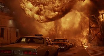 Movie still from “Daylight” (1996), directed by Rob Cohen – Cars parked on the side of the road in front of a large cloud of smoke; Extreme Wide shot, Low angle