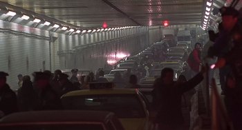 Movie still from “Daylight” (1996), directed by Rob Cohen – A bunch of cars that are in a tunnel; Extreme Wide shot, High angle