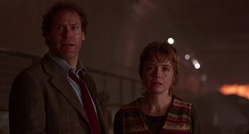 Movie still from “Daylight” (1996), directed by Rob Cohen – A man and a woman standing next to each other; Close Up shot, Low angle