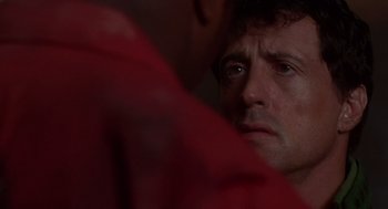 Movie still from “Daylight” (1996), directed by Rob Cohen – A person looking at the camera; Close Up shot, Over the shoulder angle