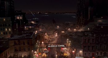 Movie still from “Daylight” (1996), directed by Rob Cohen – An aerial view of a city at night with lights; Extreme Wide shot, High angle