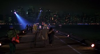 Movie still from “Daylight” (1996), directed by Rob Cohen – Two people walking on a bridge at night; Extreme Wide shot, High angle