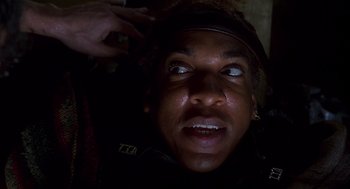 Movie still from “Daylight” (1996), directed by Rob Cohen – A man is looking up at the camera; Close Up shot, Low angle