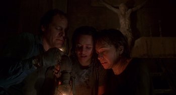 Movie still from “Daylight” (1996), directed by Rob Cohen – A group of people standing next to each other holding a lantern; Medium shot, Low angle