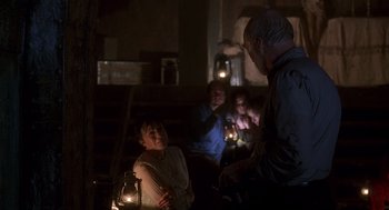 Movie still from “Daylight” (1996), directed by Rob Cohen – A group of people in a room at night with lights; Medium shot, Over the shoulder angle