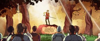 Movie still from “The Kid Who Would Be King” (2019), directed by Joe Cornish – An illustration of a man holding a sword on top of a rock; Wide shot, Over the shoulder angle