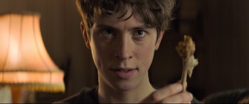 Movie still from “The Kid Who Would Be King” (2019), directed by Joe Cornish – A person with a finger in his mouth; Close Up shot, Over the shoulder angle