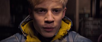 Movie still from “The Kid Who Would Be King” (2019), directed by Joe Cornish – A person wearing a yellow jacket; Close Up shot, Overhead angle