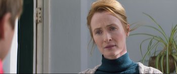 Movie still from “The Kid Who Would Be King” (2019), directed by Joe Cornish – A person wearing a sweater and looking sad; Close Up shot, Over the shoulder angle