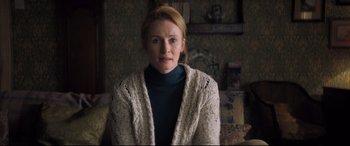 Movie still from “The Kid Who Would Be King” (2019), directed by Joe Cornish – A woman wearing a sweater and a sweater jacket; Close Up shot, Over the shoulder angle