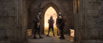 Movie still from “The Kid Who Would Be King” (2019), directed by Joe Cornish – A group of people dressed in medieval armor; Wide shot, Low angle