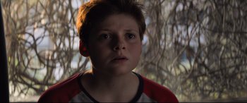 Movie still from “The Kid Who Would Be King” (2019), directed by Joe Cornish – A young boy is looking into the camera; Close Up shot, Low angle