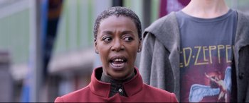 Movie still from “The Kid Who Would Be King” (2019), directed by Joe Cornish – A woman with a surprised look on her face; Close Up shot, Over the shoulder angle