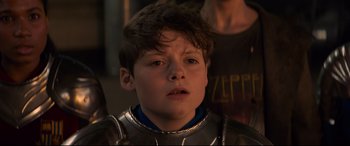 Movie still from “The Kid Who Would Be King” (2019), directed by Joe Cornish – A young boy wearing a suit of armor; Close Up shot, Over the shoulder angle