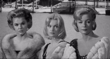Movie still from “Days of Wine and Roses” (1962), directed by Blake Edwards – A group of women standing next to each other in front of a body of water; Medium shot, Low angle