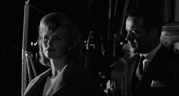 Movie still from “Days of Wine and Roses” (1962), directed by Blake Edwards – A man and a woman standing next to each other in the dark; Close Up shot, Low angle