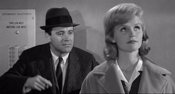 Movie still from “Days of Wine and Roses” (1962), directed by Blake Edwards – A man and a woman are standing next to each other; Medium shot, Low angle