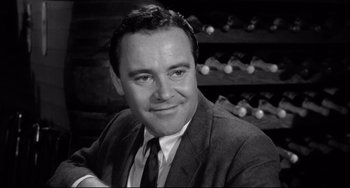 Movie still from “Days of Wine and Roses” (1962), directed by Blake Edwards – Black and white photograph of a man in a suit and tie; Close Up shot, High angle