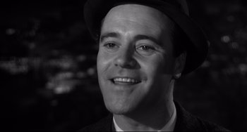 Movie still from “Days of Wine and Roses” (1962), directed by Blake Edwards – A black and white photo of a man wearing a hat; Close Up shot, Low angle