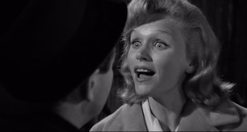 Movie still from “Days of Wine and Roses” (1962), directed by Blake Edwards – An old photo of a woman looking surprised; Close Up shot, Low angle