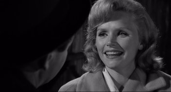 Movie still from “Days of Wine and Roses” (1962), directed by Blake Edwards – An old photo of a woman smiling at the camera; Close Up shot, Over the shoulder angle