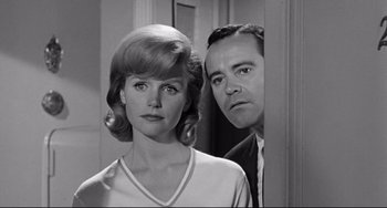 Movie still from “Days of Wine and Roses” (1962), directed by Blake Edwards – A man and a woman standing next to each other; Close Up shot, Low angle