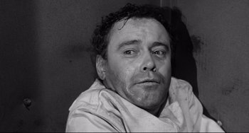 Movie still from “Days of Wine and Roses” (1962), directed by Blake Edwards – Black and white photograph of a man with wet hair; Close Up shot, Low angle