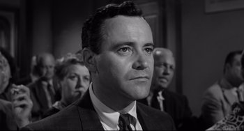 Movie still from “Days of Wine and Roses” (1962), directed by Blake Edwards – Black and white photograph of a man in a suit and tie; Close Up shot, Low angle