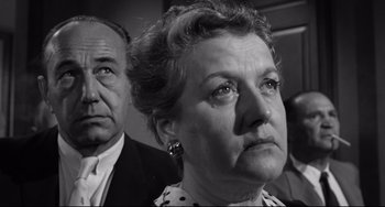 Movie still from “Days of Wine and Roses” (1962), directed by Blake Edwards – An older man and a woman looking into the distance; Close Up shot, Low angle