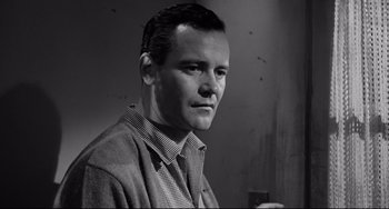 Movie still from “Days of Wine and Roses” (1962), directed by Blake Edwards – Black and white photograph of a man in a plaid shirt; Close Up shot, Low angle