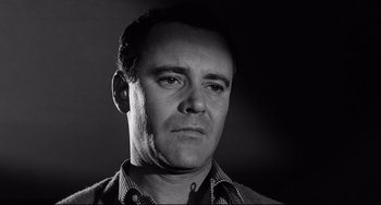 Movie still from “Days of Wine and Roses” (1962), directed by Blake Edwards – Black and white photograph of a man in a plaid shirt; Close Up shot, Low angle