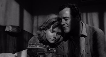 Movie still from “Days of Wine and Roses” (1962), directed by Blake Edwards – A man and a woman looking at a camera; Close Up shot, Low angle