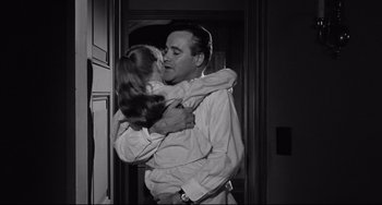 Movie still from “Days of Wine and Roses” (1962), directed by Blake Edwards – A man and a little girl kissing each other; Medium shot, Low angle