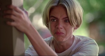 Movie still from “Dazed and Confused” (1993), directed by Richard Linklater – A person with short blonde hair; Close Up shot, Low angle