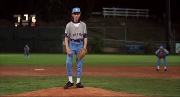 Movie still from “Dazed and Confused” (1993), directed by Richard Linklater – A baseball player is standing on the field; Wide shot, Overhead angle