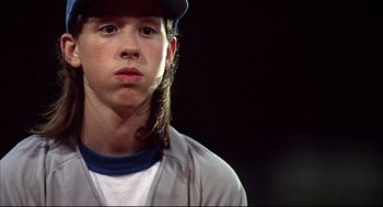 Movie still from “Dazed and Confused” (1993), directed by Richard Linklater – A young man with long hair wearing a baseball cap; Close Up shot, Low angle