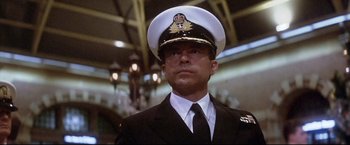 Movie still from “Dead Calm” (1989), directed by Phillip Noyce – A person wearing a uniform; Close Up shot, Low angle