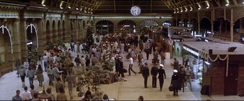 Movie still from “Dead Calm” (1989), directed by Phillip Noyce – A crowd of people walking around a train station; Extreme Wide shot, High angle