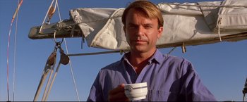 Movie still from “Dead Calm” (1989), directed by Phillip Noyce – A person holding a coffee cup; Close Up shot, Low angle
