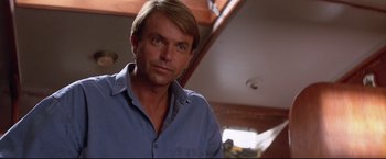 Movie still from “Dead Calm” (1989), directed by Phillip Noyce – A person wearing a blue shirt; Close Up shot, Low angle