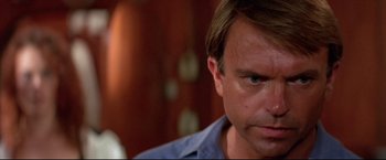 Movie still from “Dead Calm” (1989), directed by Phillip Noyce – A man's face as he stares into the camera; Close Up shot, Low angle