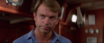 Movie still from “Dead Calm” (1989), directed by Phillip Noyce – A person wearing a blue shirt; Close Up shot, Low angle