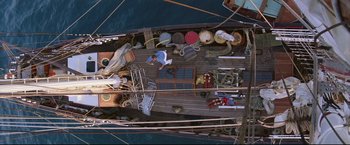Movie still from “Dead Calm” (1989), directed by Phillip Noyce – An overhead view of a boat with a lot of stuff on the deck; Extreme Wide shot, Overhead angle