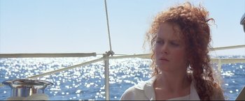 Movie still from “Dead Calm” (1989), directed by Phillip Noyce – A person on a sailboat in the water; Close Up shot, Low angle