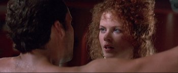 Movie still from “Dead Calm” (1989), directed by Phillip Noyce – A man and a woman looking at each other in a mirror; Close Up shot, Over the shoulder angle