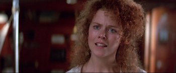 Movie still from “Dead Calm” (1989), directed by Phillip Noyce – A person with curly red hair; Close Up shot, Low angle
