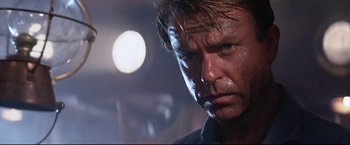 Movie still from “Dead Calm” (1989), directed by Phillip Noyce – A man's face in the dark; Close Up shot, Low angle