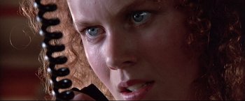Movie still from “Dead Calm” (1989), directed by Phillip Noyce – A woman's face with blue eyes; Extreme Close Up shot, Low angle