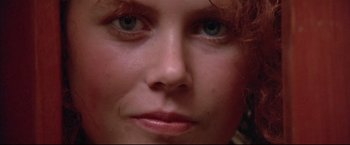 Movie still from “Dead Calm” (1989), directed by Phillip Noyce – A woman's face with blue eyes; Extreme Close Up shot, Low angle
